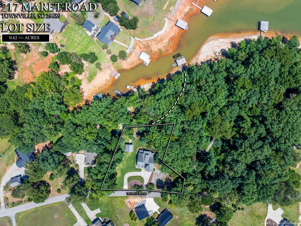 217 Maret Road Townville, SC 29689 - Photo 33 of 35 An aerial view captures a waterfront property featuring a private dock and mature trees.