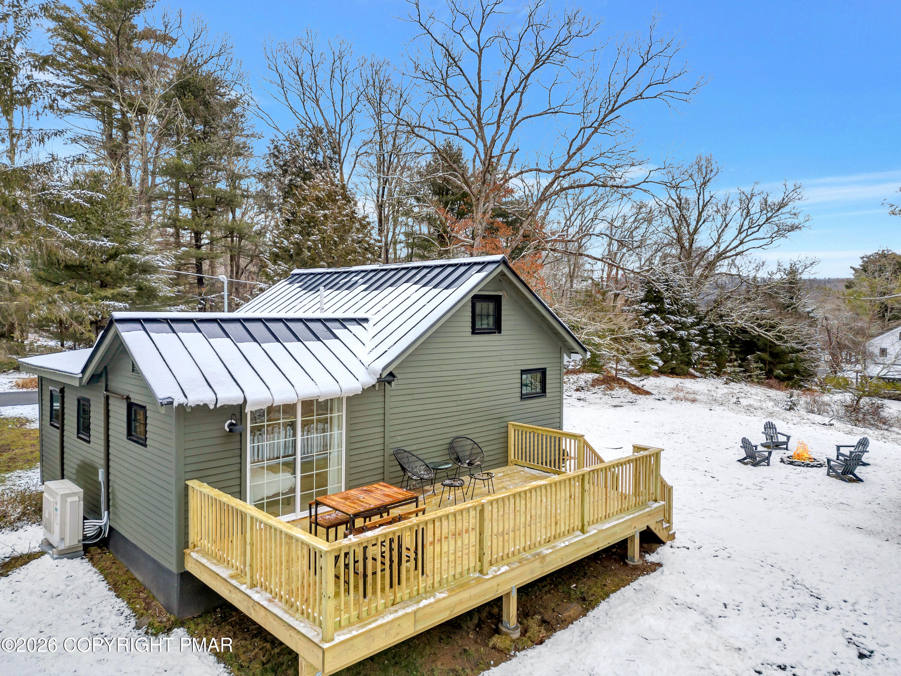 353 German Hill Road Shohola, PA 18458 - Photo 2 of 35 a view of a house with a wooden deck and trees