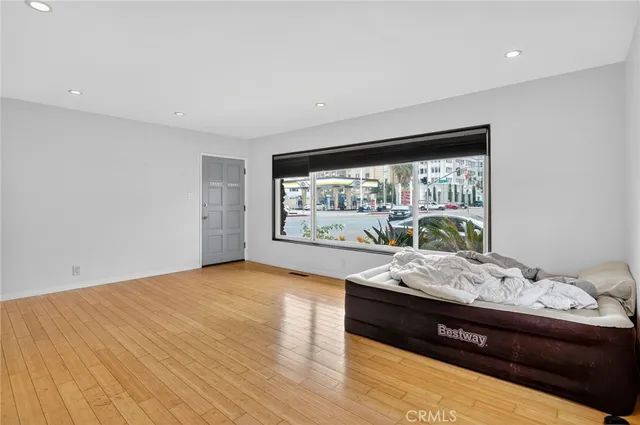 a living room with furniture window and wooden floor