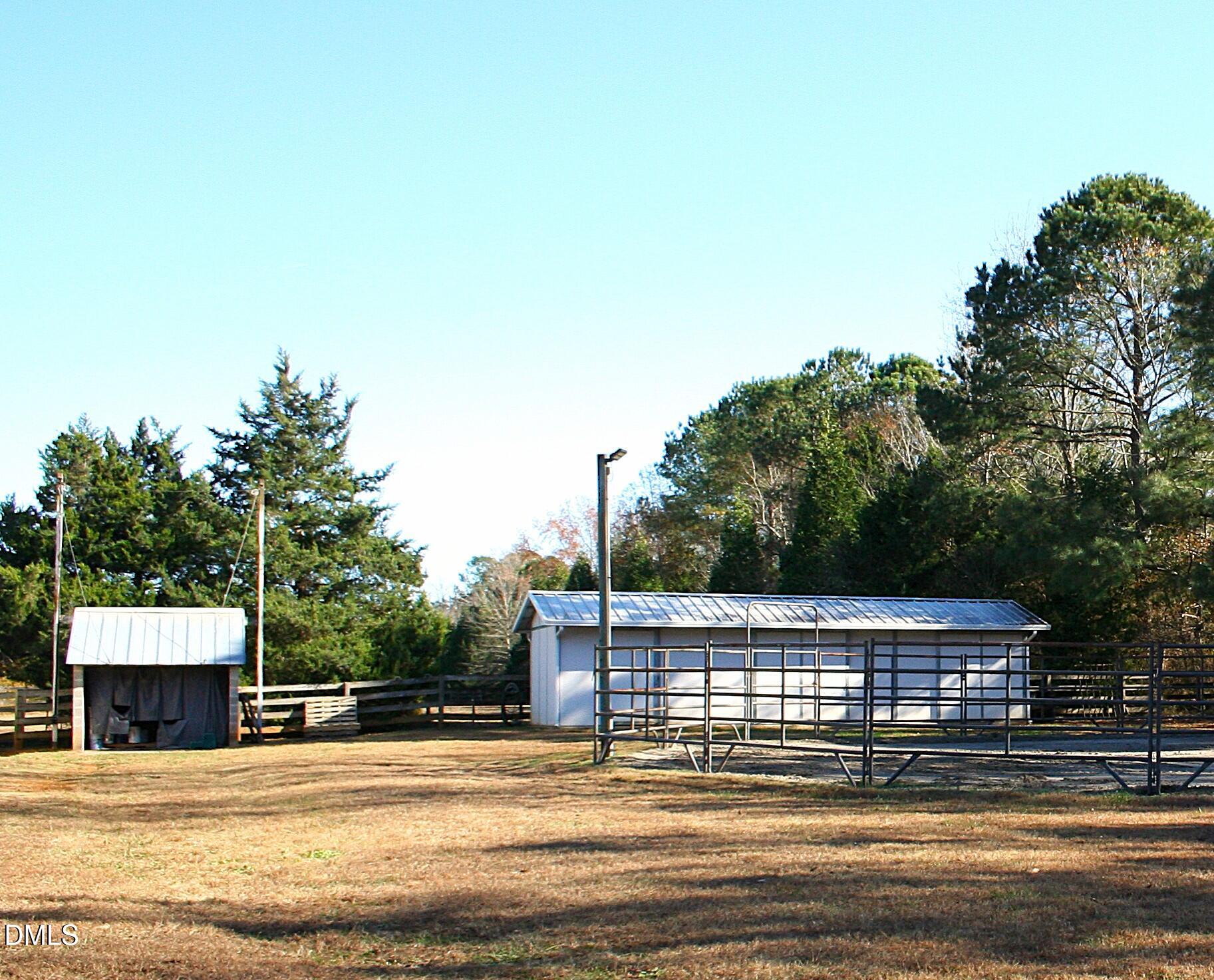 220 Jordan Narron Road Selma, NC 27576 - Photo 65 of 87 a view of a swimming pool with an outdoor space and seating area