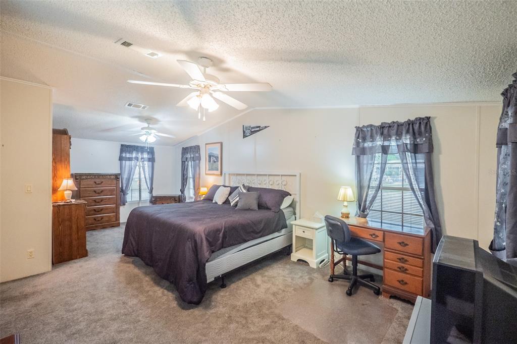 37510 Quail Ridge Circle Leesburg, FL 34788 - Photo 20 of 43 a bedroom with a bed and a window