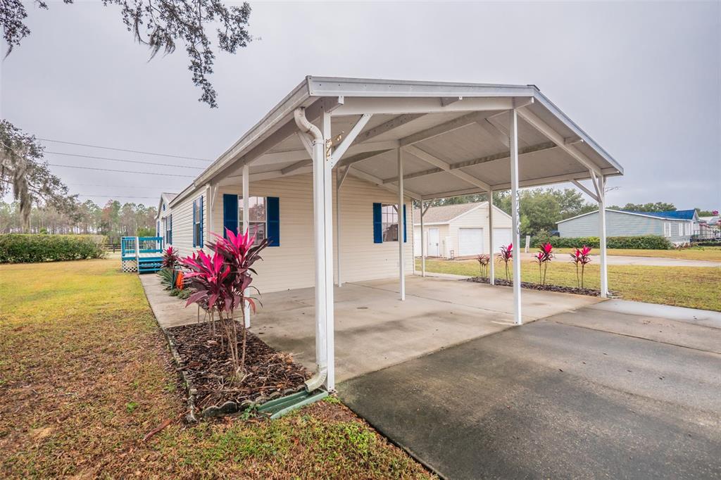 37510 Quail Ridge Circle Leesburg, FL 34788 - Photo 5 of 43 a view of a house with backyard porch and sitting area