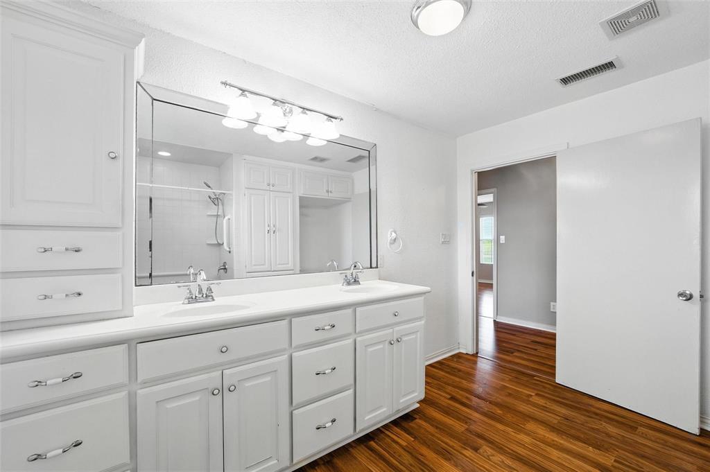 358 Wright Road Waxahachie, TX 75167 - Photo 30 of 38 a spacious bathroom with a double vanity sink and a mirror