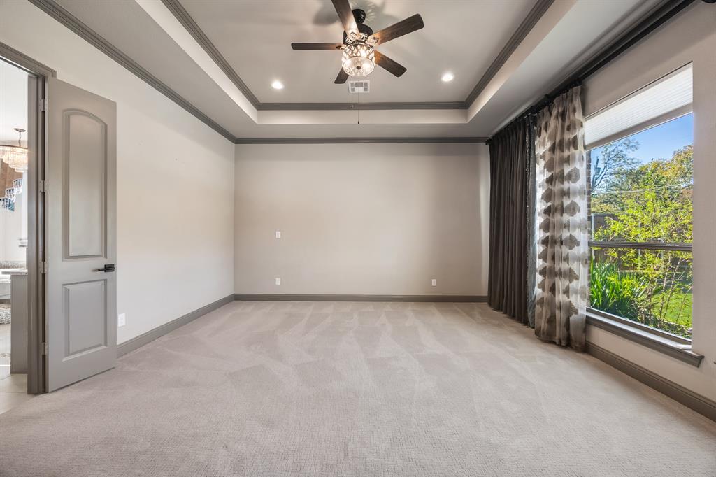 326 Prairie View Road Rockwall, TX 75087 - Photo 20 of 40 a view of a livingroom with a ceiling fan and window