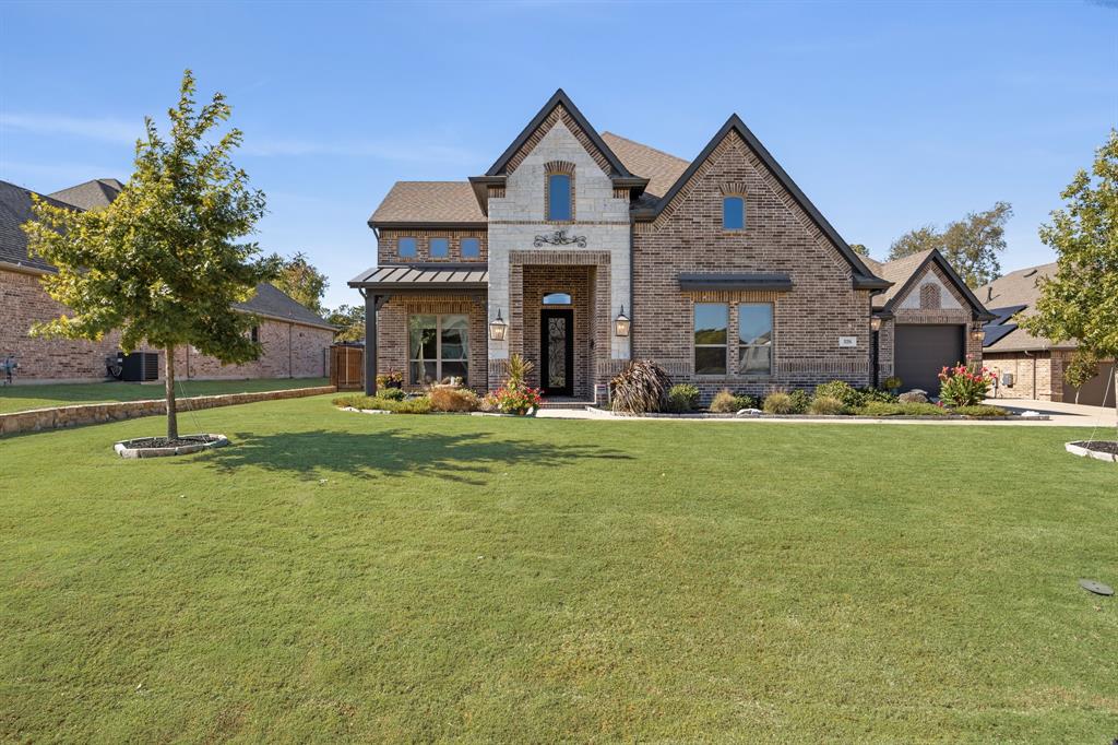 326 Prairie View Road Rockwall, TX 75087 - Photo 2 of 40 a front view of a house with a yard