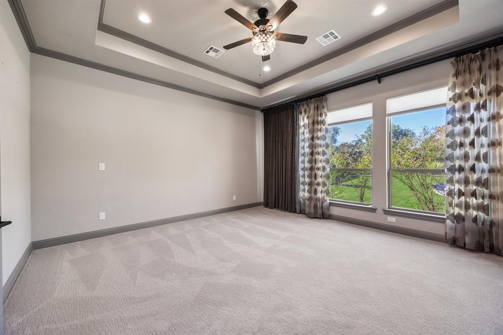 326 Prairie View Road Rockwall, TX 75087 - Photo 21 of 40 a view of an empty room with a window and a ceiling fan