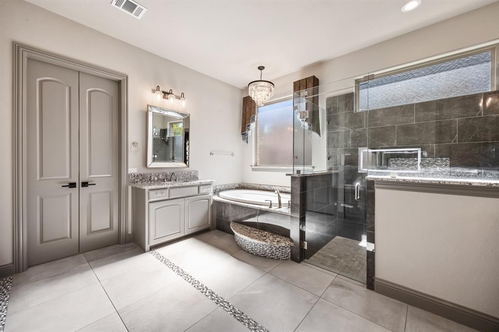 326 Prairie View Road Rockwall, TX 75087 - Photo 22 of 40 a large white bathroom with a granite countertop sink mirror and bathtub