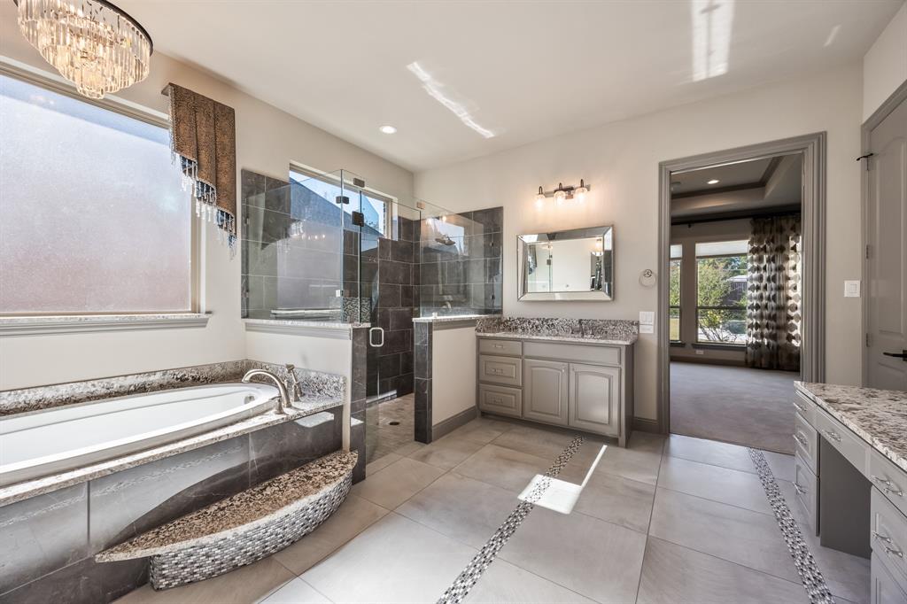 326 Prairie View Road Rockwall, TX 75087 - Photo 23 of 40 a kitchen with a sink stove and cabinets