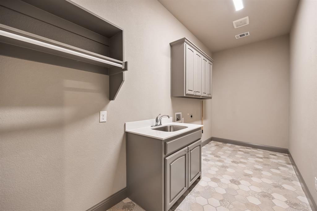 326 Prairie View Road Rockwall, TX 75087 - Photo 30 of 40 a utility room with a sink washer and dryer
