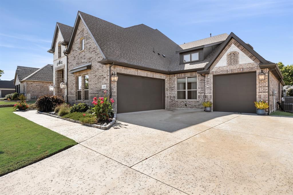 326 Prairie View Road Rockwall, TX 75087 - Photo 4 of 40 a front view of a house with a yard and garage