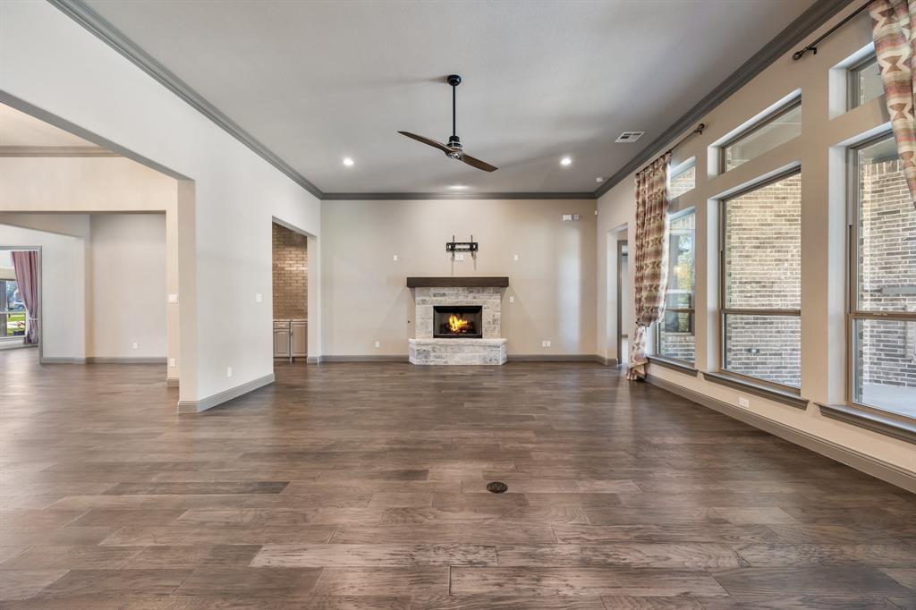 326 Prairie View Road Rockwall, TX 75087 - Photo 7 of 40 a view of an empty room with a fireplace and a window
