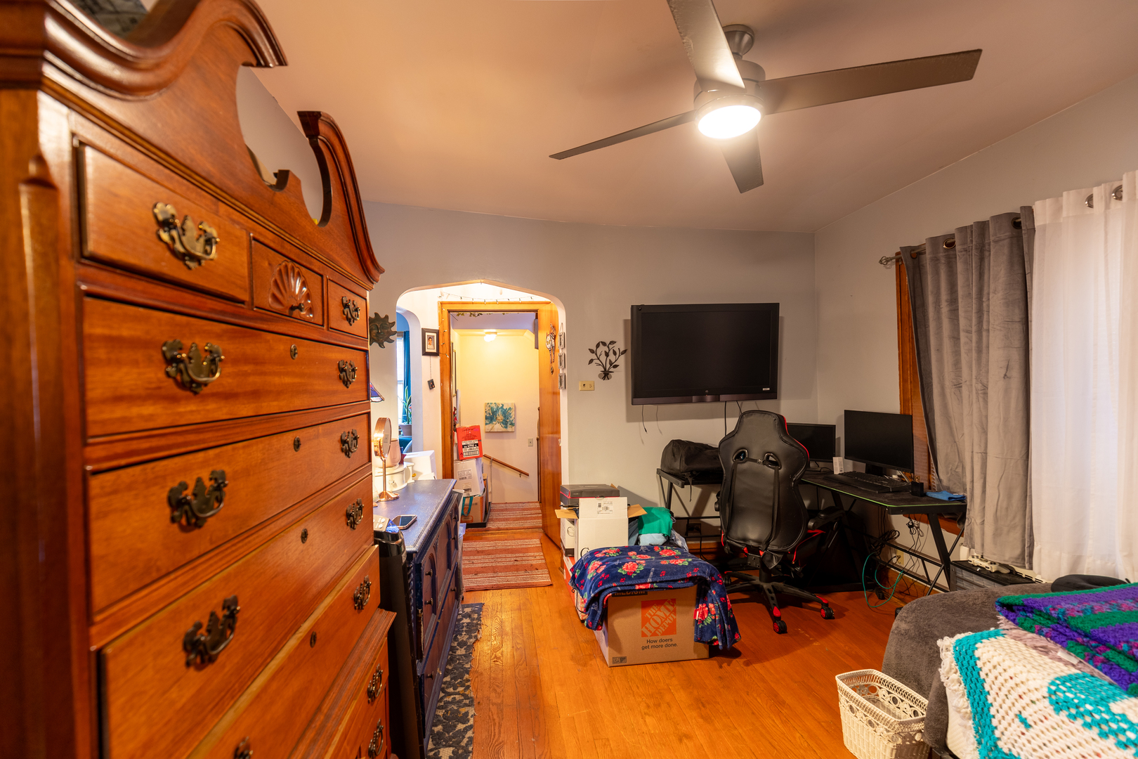 1626 Home Avenue Berwyn, IL 60402 - Photo 14 of 23 a bed room with a bed tv and a window