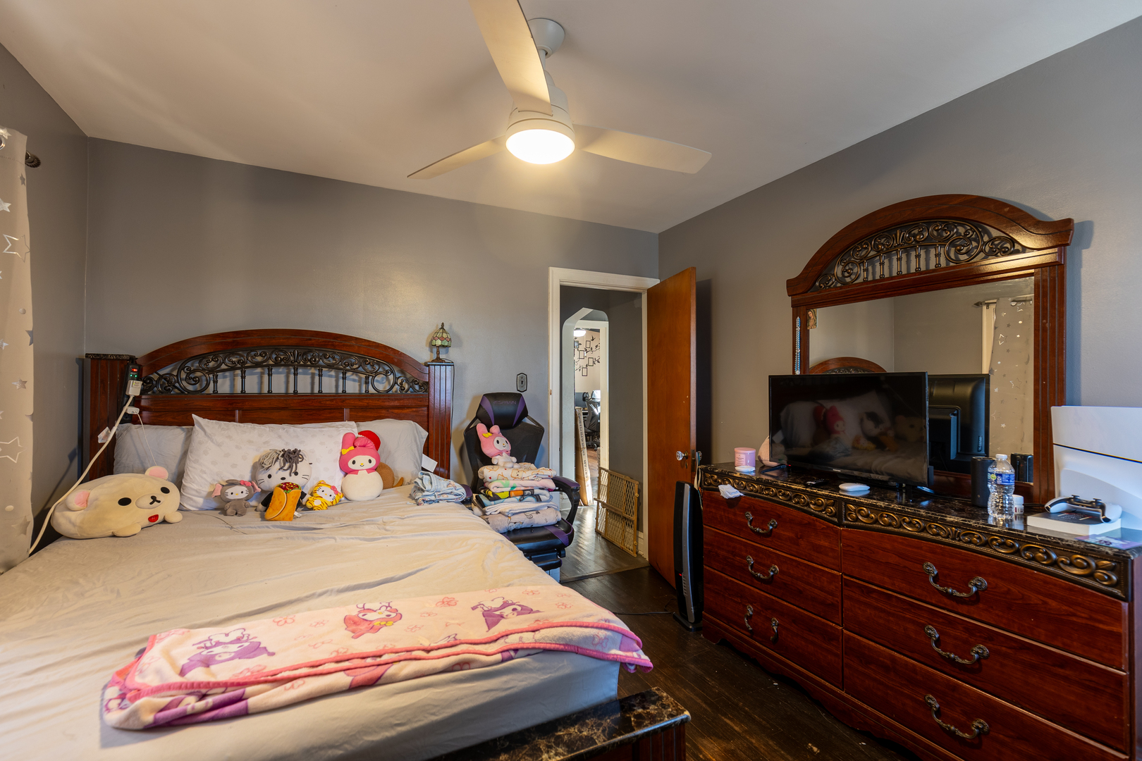 1626 Home Avenue Berwyn, IL 60402 - Photo 18 of 23 a bedroom with a bed and a flat tv screen on dresser