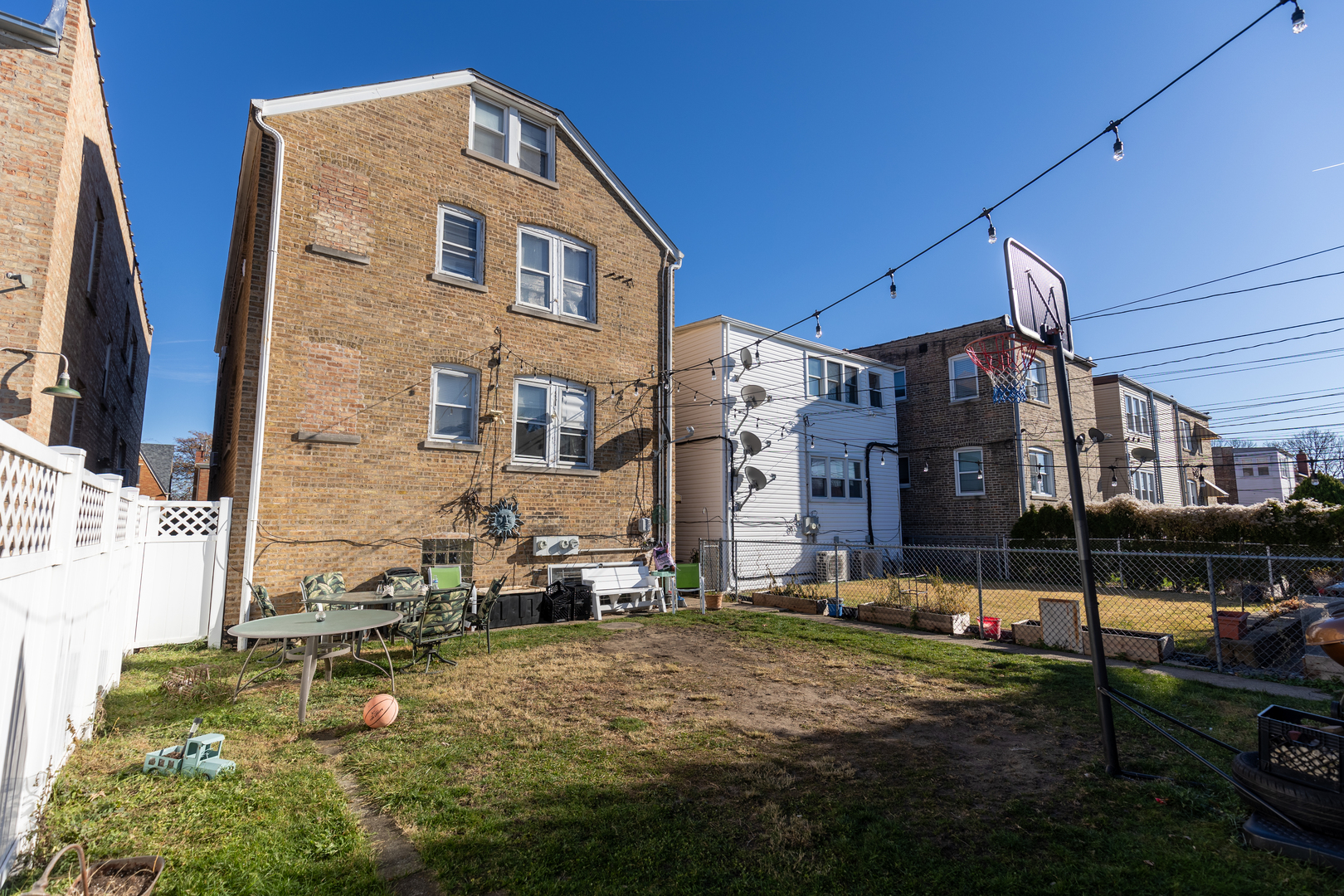 1626 Home Avenue Berwyn, IL 60402 - Photo 22 of 23 a backyard of a building with lawn chairs