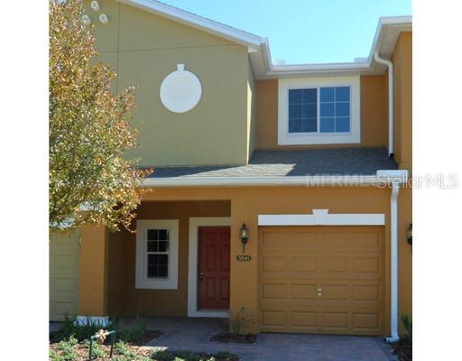 a view of a room with a door and wooden floor