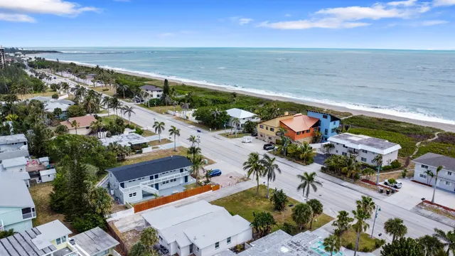 an aerial view of residential houses with outdoor space