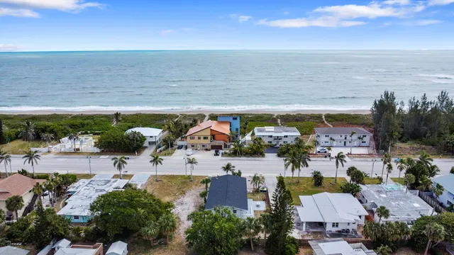 an aerial view of a house with a outdoor space