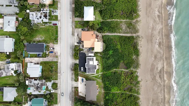 an aerial view of residential house with outdoor space and street view