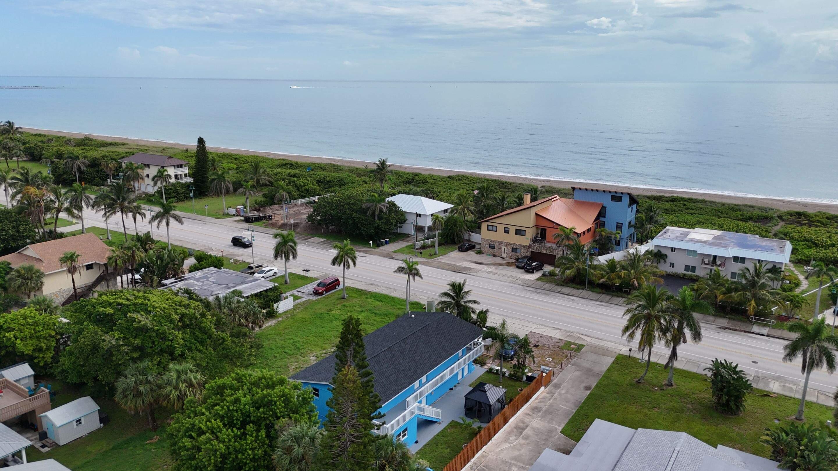 1115 South Ocean Drive, Unit 1 Fort Pierce, FL 34949 - Photo 8 of 48 an aerial view of multiple houses with yard