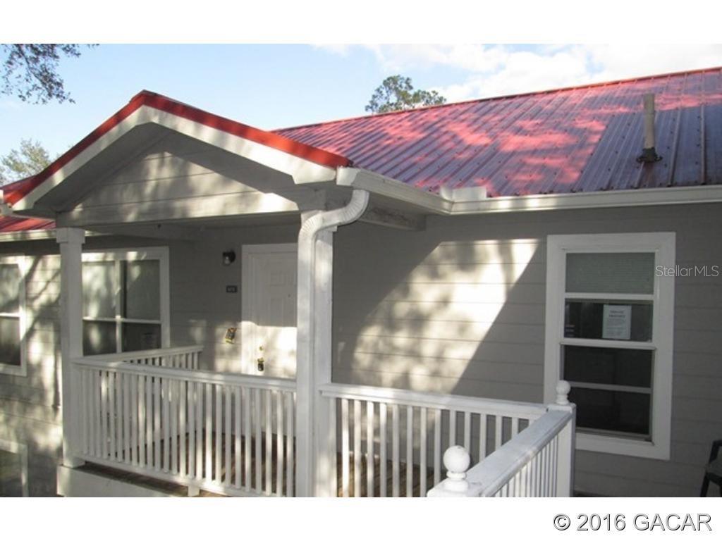 2905 Southwest Archer Road, Unit 5013 Gainesville, FL 32608 - Photo 1 of 1 a view of a house with a balcony