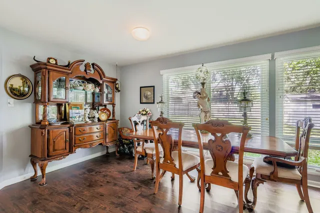 a kitchen with a stove a sink and cabinets