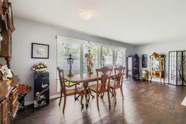 a view of a livingroom with furniture and a window