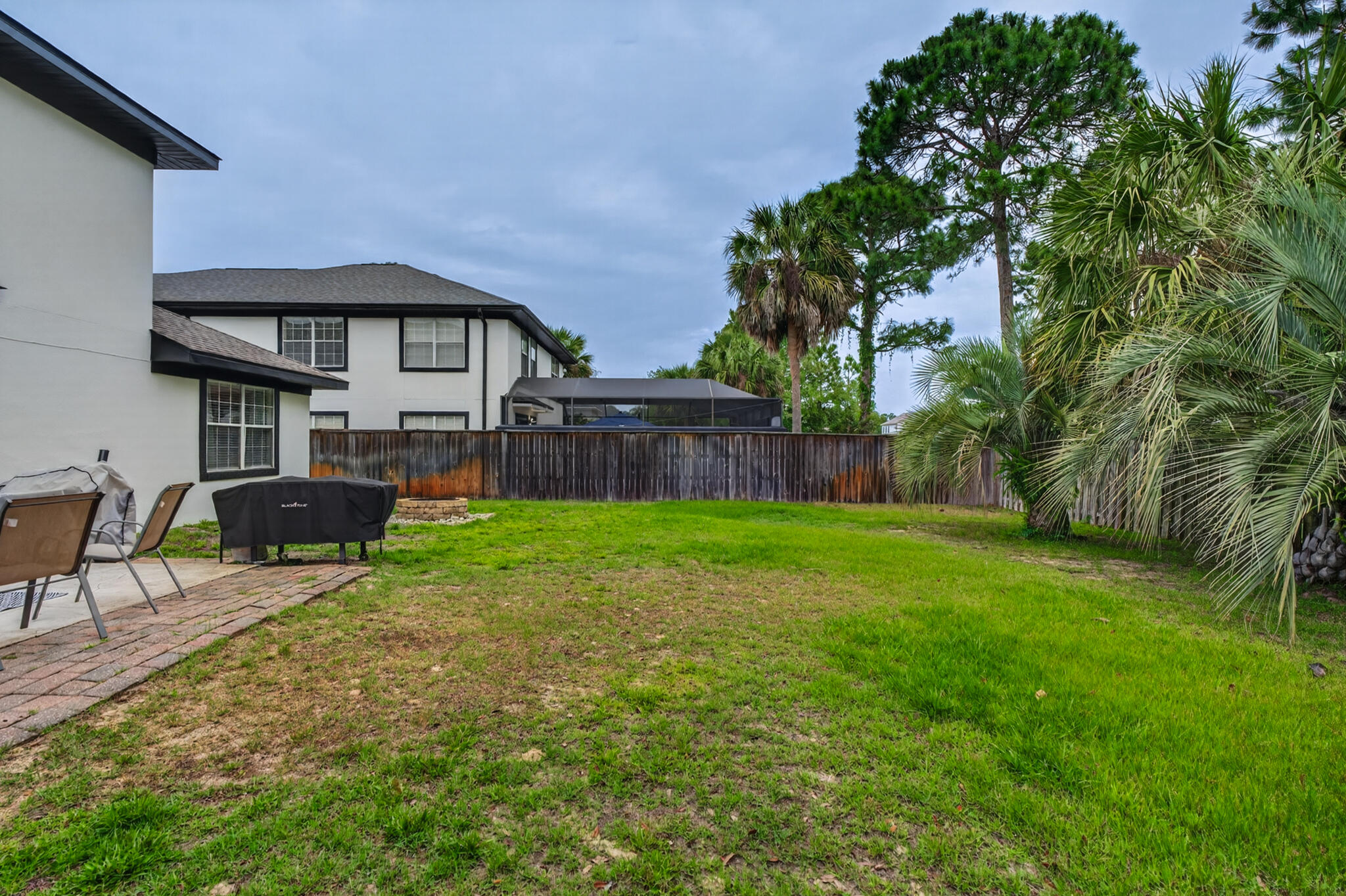 268 Loblolly Bay Drive Santa Rosa Beach, FL 32459 - Photo 52 of 73 a view of a house with a yard and sitting area