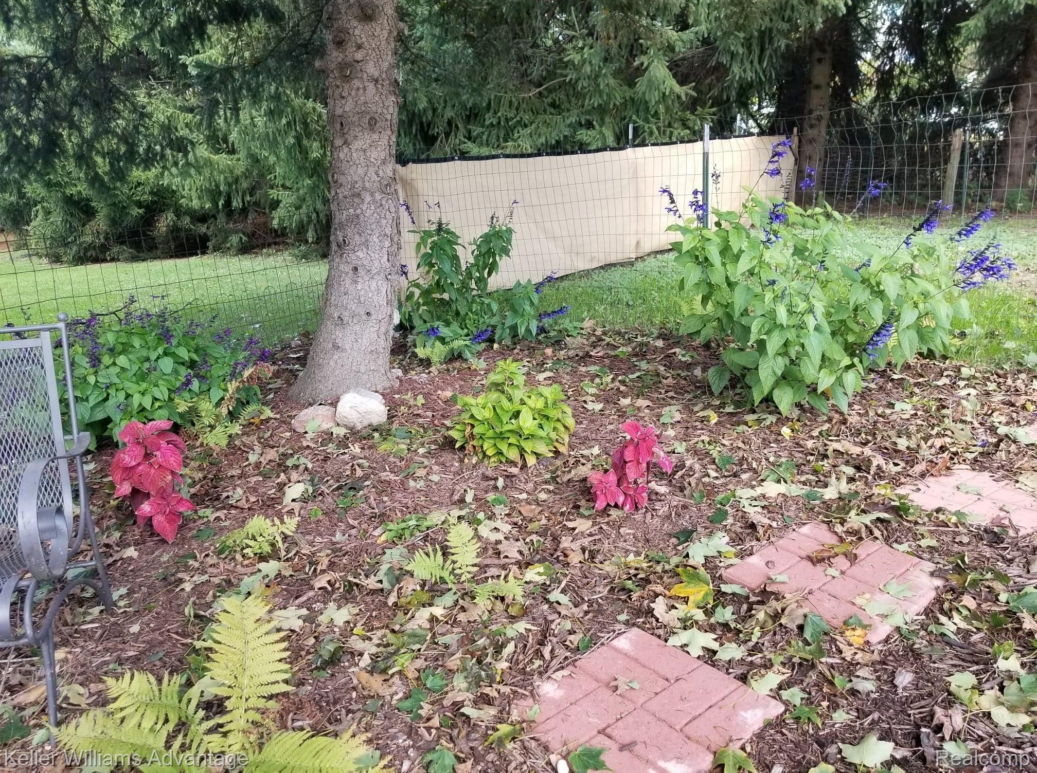 10997 East Prior Road Durand, MI 48429 - Photo 63 of 66 Corner garden sitting area in the shade