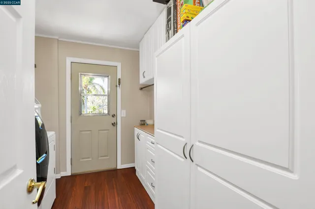 a bedroom with a large bed and a chandelier fan