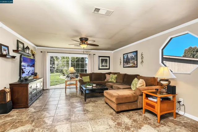 a view of a workspace with furniture and a bathroom