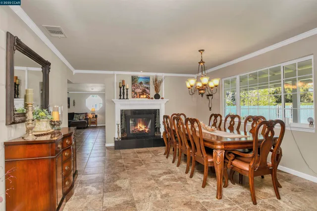 a kitchen with stainless steel appliances granite countertop wooden cabinets and a sink