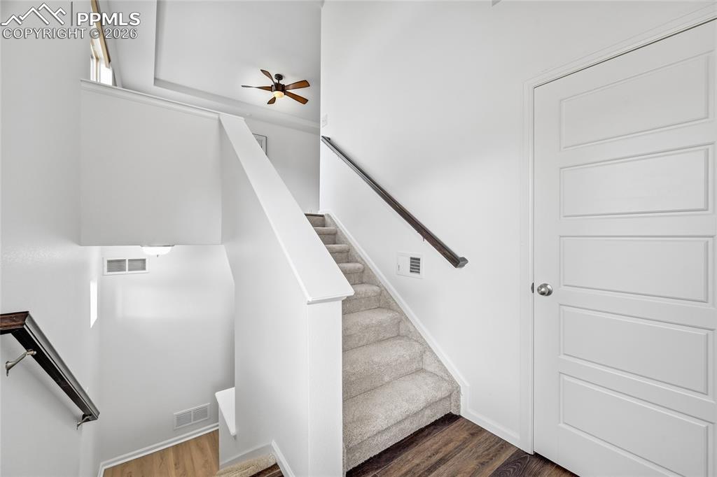 9414 Timberlake Loop Colorado Springs, CO 80927 - Photo 5 of 40 Foyer Entry way Stairs and luxury vinyl wood finished floors