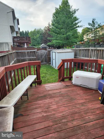 a view of a deck with two chairs and a table