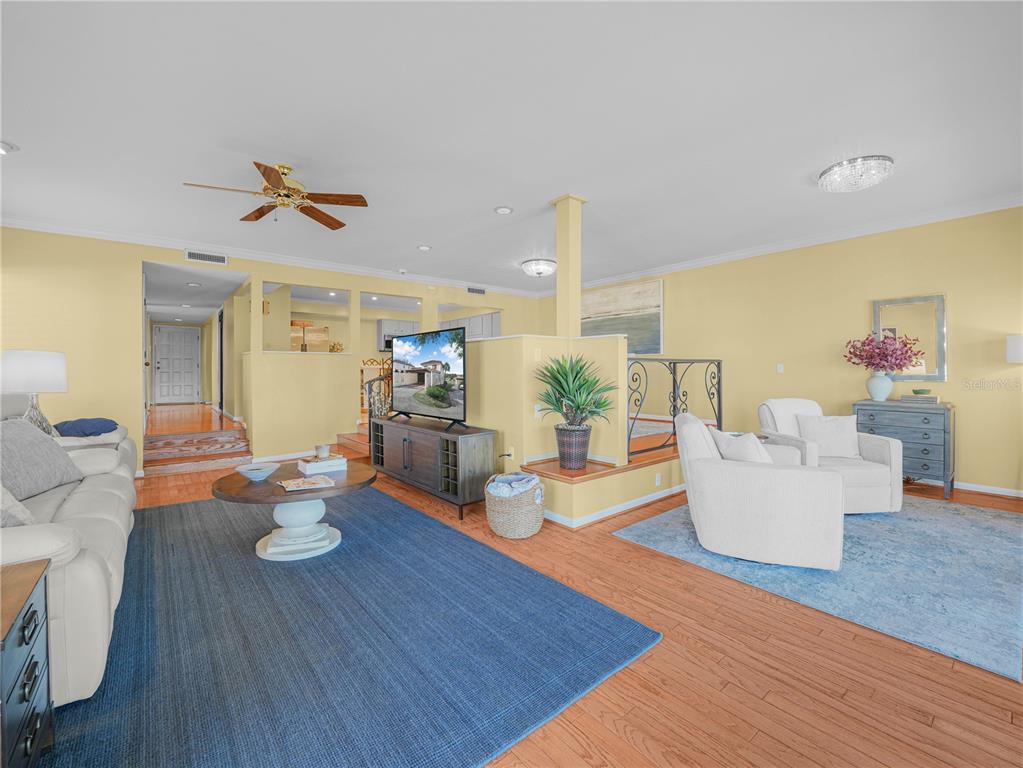 3 Casa Loma Way, Unit 3 Lakeland, FL 33813 - Photo 12 of 45 a living room with dining table and wooden floor