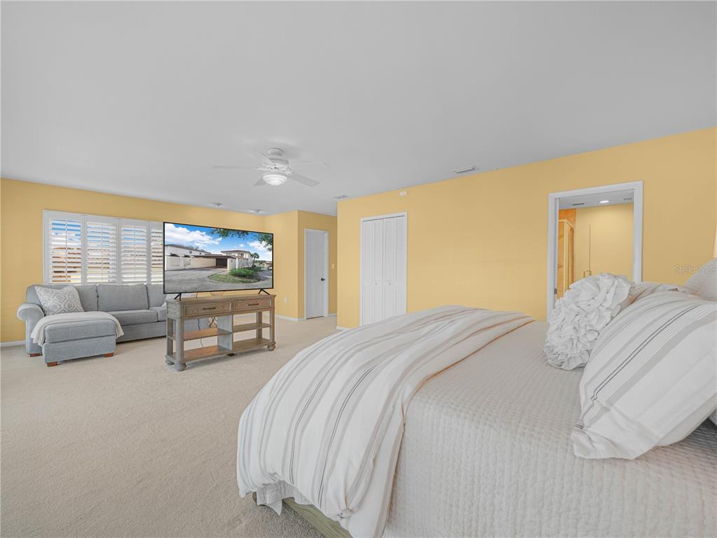 3 Casa Loma Way, Unit 3 Lakeland, FL 33813 - Photo 18 of 45 a bedroom with a bed and a couch