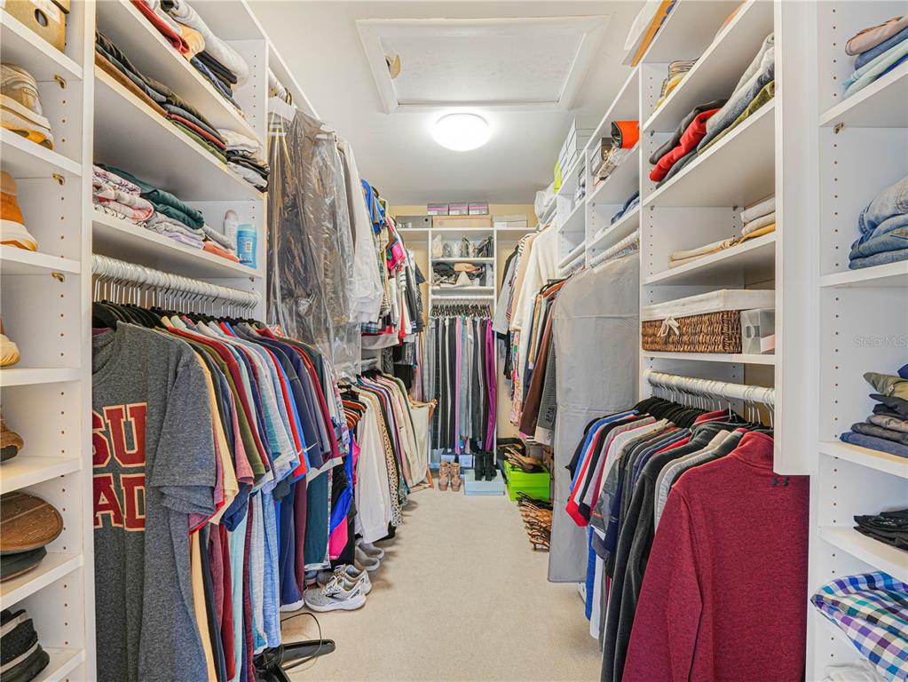 3 Casa Loma Way, Unit 3 Lakeland, FL 33813 - Photo 19 of 45 a view of walk in closet with clothes and shoes