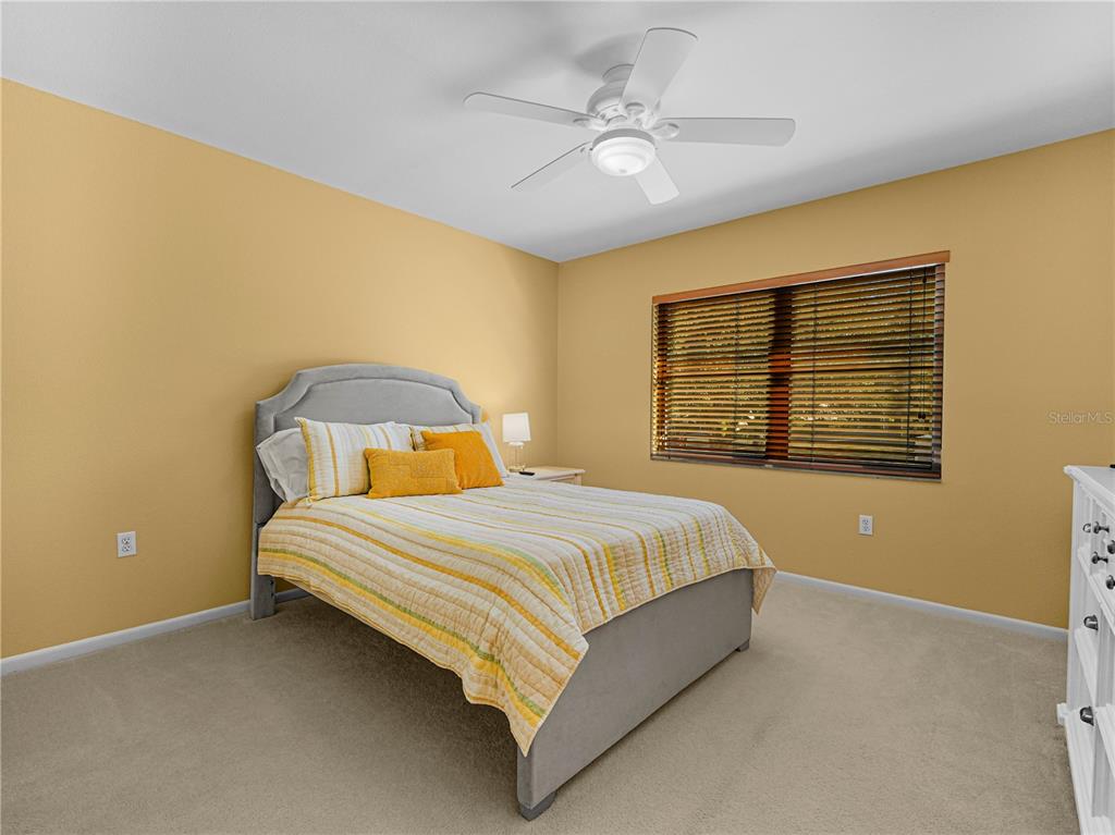 3 Casa Loma Way, Unit 3 Lakeland, FL 33813 - Photo 25 of 45 a bedroom with a bed and window