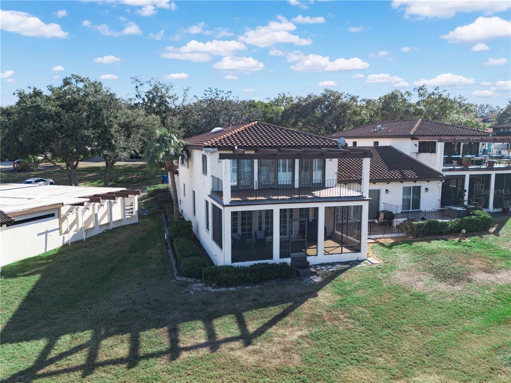 3 Casa Loma Way, Unit 3 Lakeland, FL 33813 - Photo 34 of 45 a front view of a house with a yard table and chairs