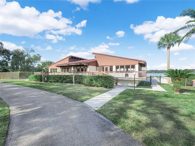 a view of houses with yard and entertaining space