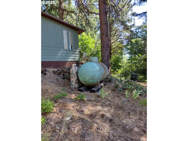 a backyard of a house with outdoor seating