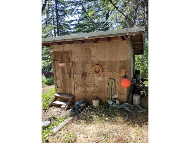 a view of a bench under a tree