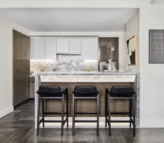 a view of a dining room that has a table and chairs