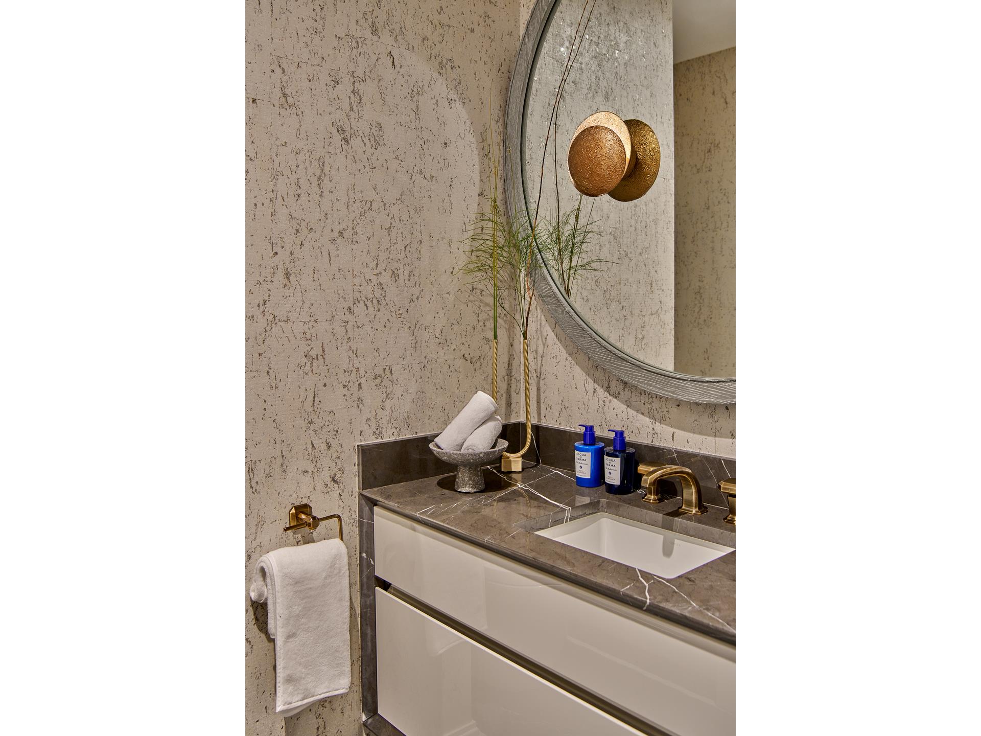 303 Park Avenue, Unit 2022 Manhattan, NY 10022 - Photo 4 of 27 a bathroom with a sink and a mirror