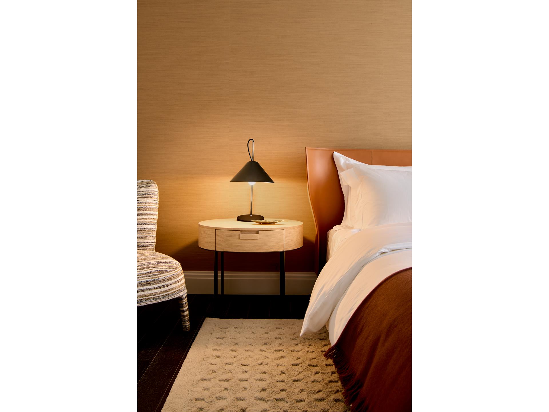 303 Park Avenue, Unit 2022 Manhattan, NY 10022 - Photo 7 of 27 a living room with furniture and a lamp