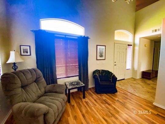 1109 Rebecca Avenue Ridgecrest, CA 93555 - Photo 14 of 50 a bedroom with a bed and a couch