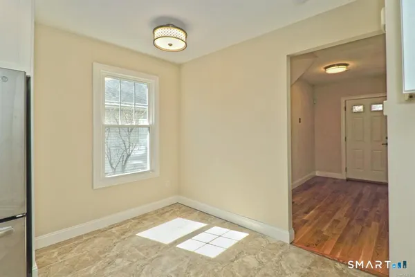 a view of an empty room and window
