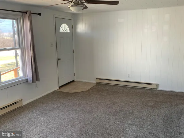 a view of an empty room and window