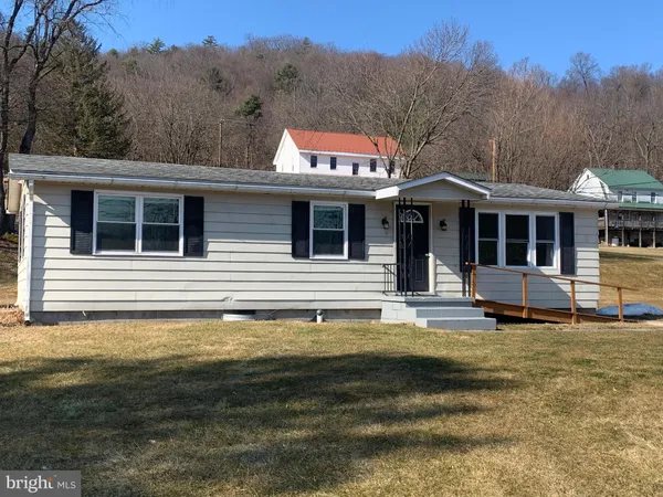 a swimming pool with trees in the background