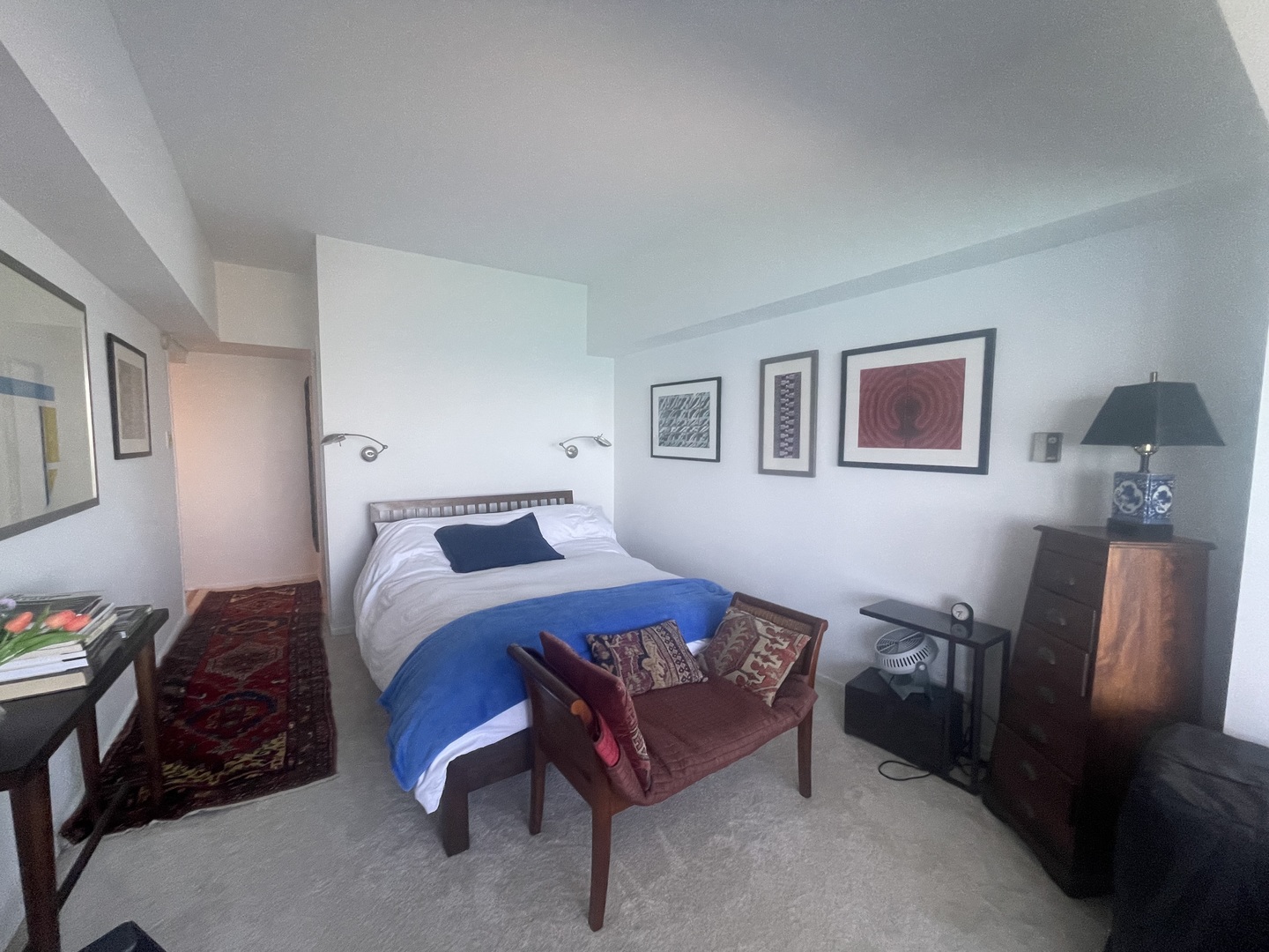 175 East Delaware Place, Unit 5403 Chicago, IL 60611 - Photo 13 of 20 a bedroom with a bed and wooden floor
