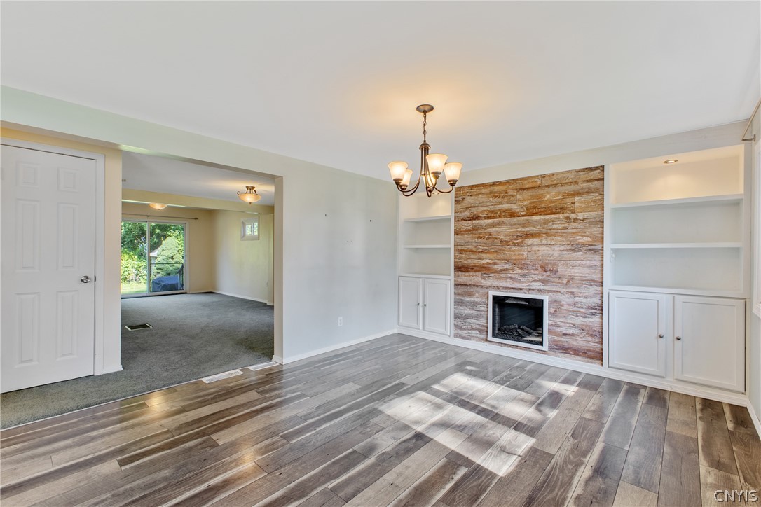 125 Circle Road Salina, NY 13212 - Photo 6 of 39 Step inside to your large formal dining area with a cozy fireplace!